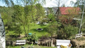 A park with a playground, benches, and a fire pit. - Apartment Type 1 - Meutzner Trassenheide, "Villa Seute Deern" (Trassenheide)