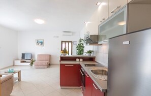 Fridge, stovetop, dishwasher, coffee/tea maker