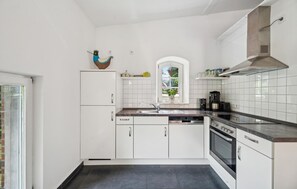 Fridge, stovetop, dishwasher, coffee/tea maker