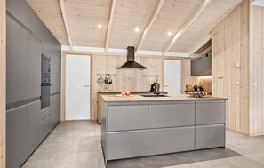 Fridge, stovetop, dishwasher, coffee/tea maker