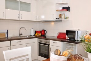 Fridge, oven, dishwasher, high chair