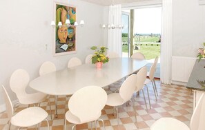 Enjoy meals in this stylish dining area with a large oval table and comfortable seating for all.