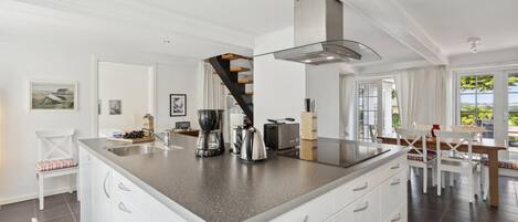 Fridge, stovetop, dishwasher, coffee/tea maker