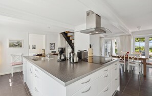 Fridge, stovetop, dishwasher, coffee/tea maker