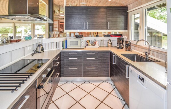 Fridge, stovetop, dishwasher, coffee/tea maker