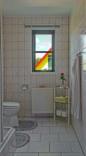 Shower, towels, soap, toilet paper