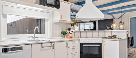 Fridge, stovetop, dishwasher, coffee/tea maker