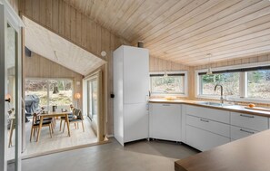 Fridge, stovetop, dishwasher, coffee/tea maker