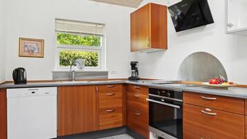 Fridge, stovetop, dishwasher, coffee/tea maker