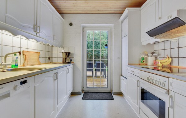 Fridge, stovetop, dishwasher, coffee/tea maker