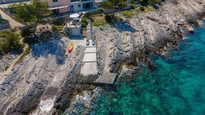 A coastal property with a large house, a private dock, and clear blue waters. - Gorgeous home in Crnja Luka (Crnja Luka)