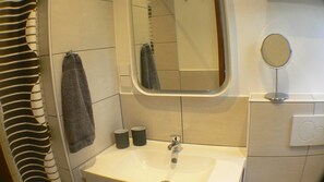 Shower, hair dryer, towels, toilet paper