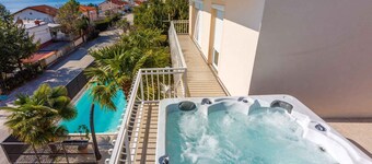 Holiday apartment with private hot tub and shared swimming pool