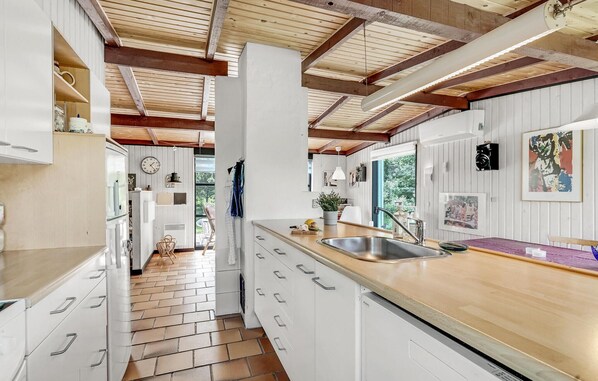 Fridge, stovetop, dishwasher, coffee/tea maker