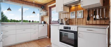 Fridge, stovetop, dishwasher, coffee/tea maker