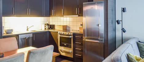 Fridge, stovetop, dishwasher, coffee/tea maker