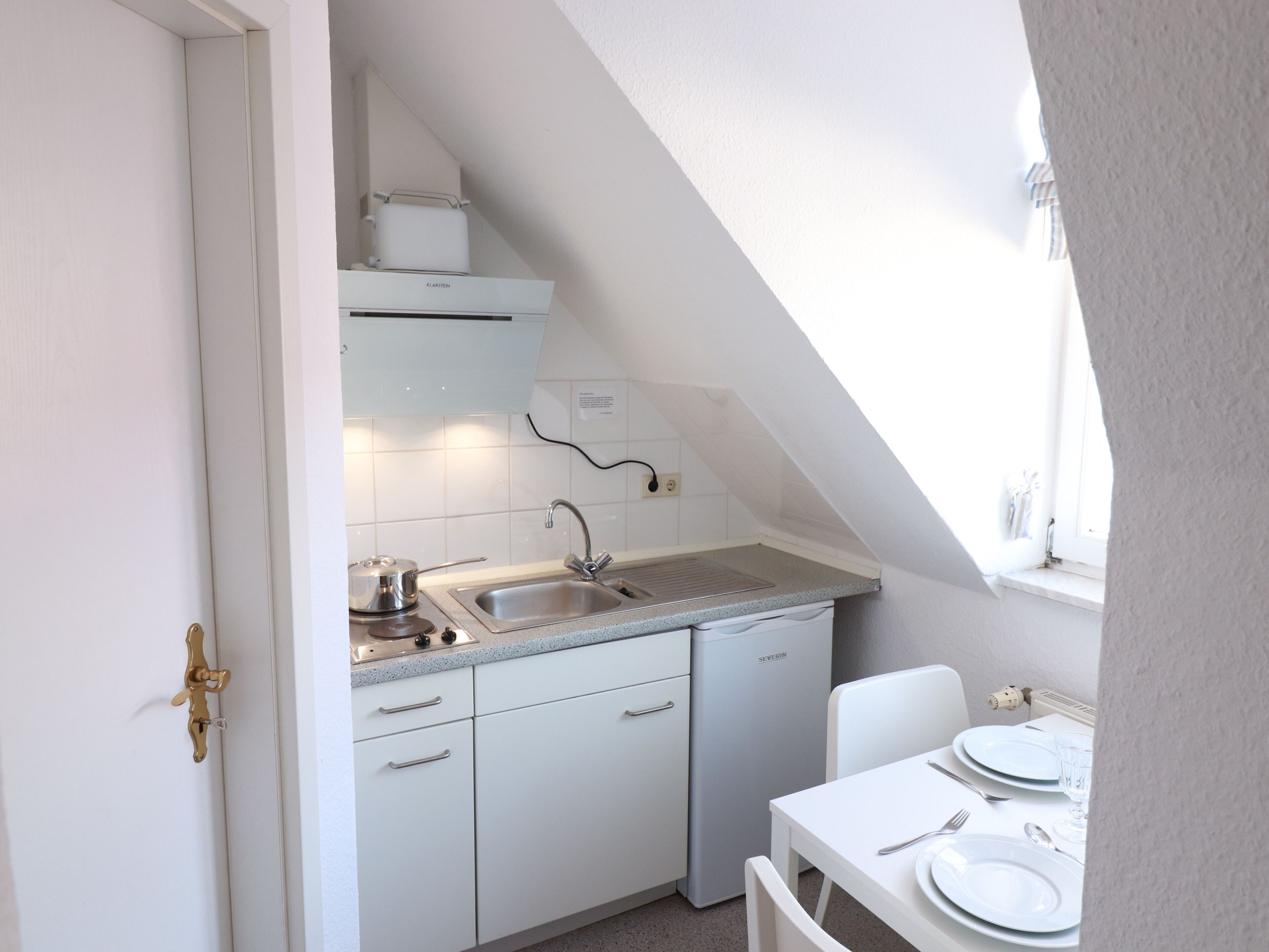 Fridge, coffee/tea maker, electric kettle, toaster