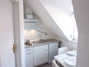 Fridge, coffee/tea maker, electric kettle, toaster