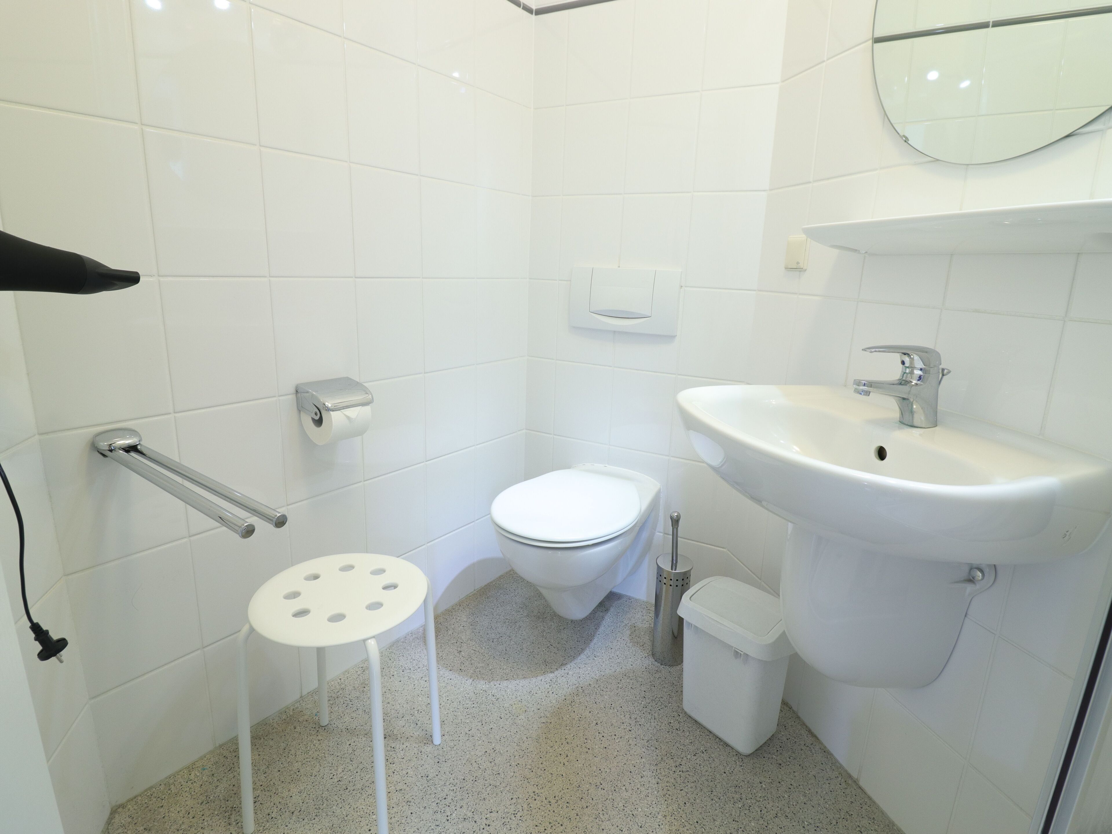 Shower, hair dryer, towels, toilet paper