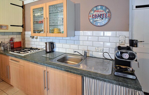 Fridge, microwave, stovetop, coffee/tea maker