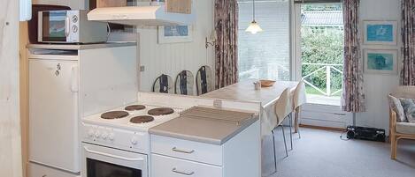Fridge, stovetop, dishwasher, coffee/tea maker