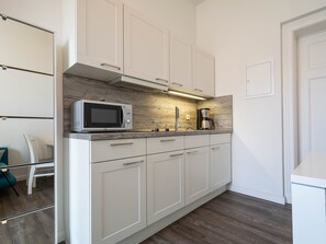 Fridge, coffee/tea maker, electric kettle, toaster