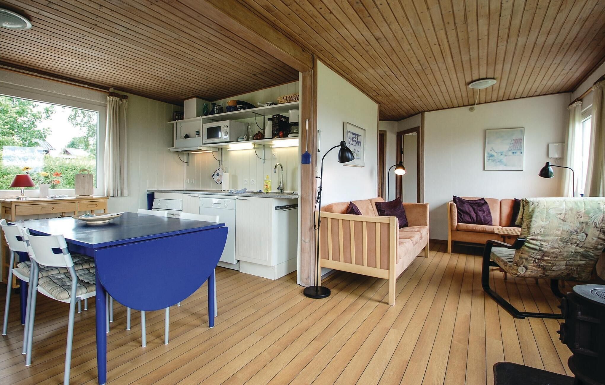 A compact living space with a kitchen, dining area, and seating area.