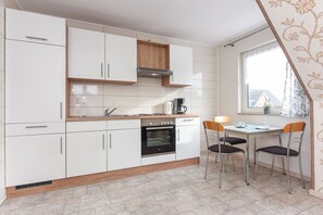 Fridge, coffee/tea maker, electric kettle, toaster