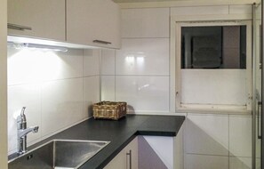 Fridge, stovetop, dishwasher, coffee/tea maker