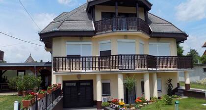 Holiday apartment with children's playground, sandbox and paddling pool