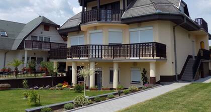 Holiday apartment with children's playground, sandbox and paddling pool