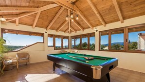 A pool table in a room with wooden beams and large windows. - Cozy home in Zgaljici with sauna (Zgaljici)