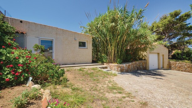 A single-story building with a stone foundation, a small window, and a door. - 1 bedroom beautiful home in Calvi (Calvi)