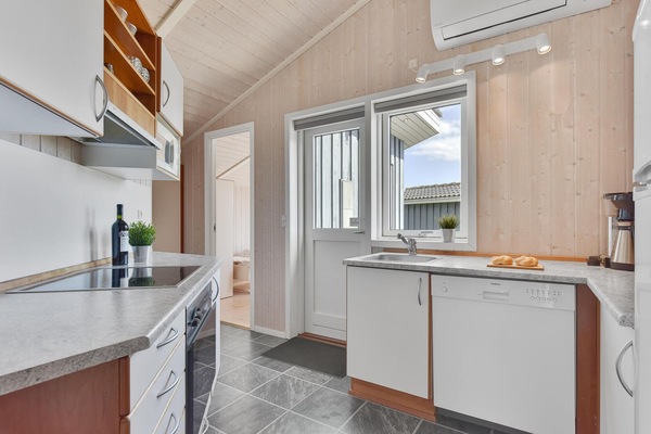 Fridge, stovetop, dishwasher, coffee/tea maker