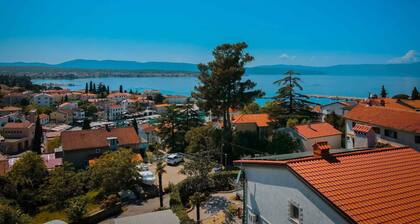 Holiday apartment with balcony and sea view