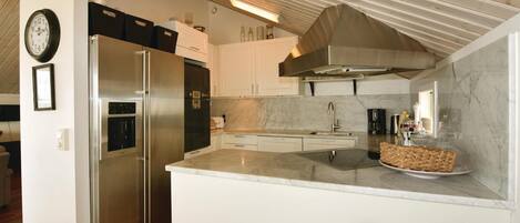 Fridge, stovetop, dishwasher, coffee/tea maker
