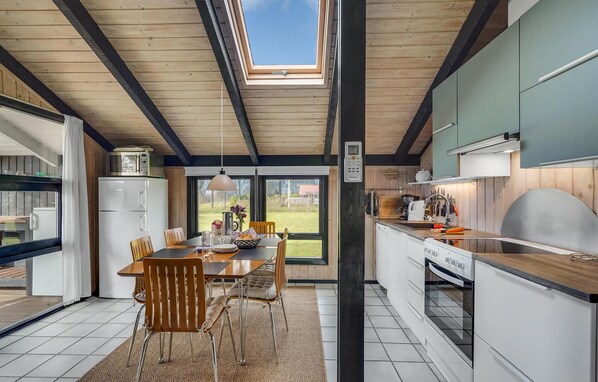 Fridge, stovetop, dishwasher, coffee/tea maker