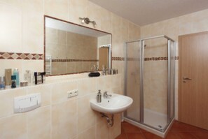 Shower, towels, toilet paper