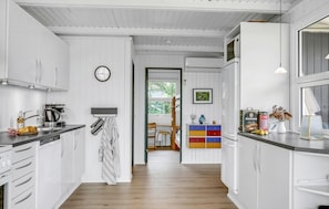 Fridge, stovetop, dishwasher, coffee/tea maker
