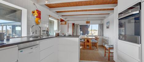 Fridge, stovetop, dishwasher, coffee/tea maker
