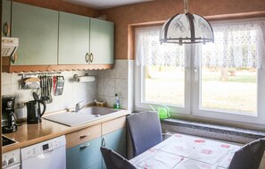 Fridge, stovetop, dishwasher, coffee/tea maker