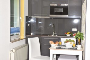 Fridge, microwave, high chair
