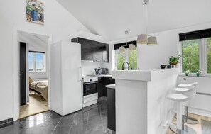 Fridge, stovetop, dishwasher, coffee/tea maker