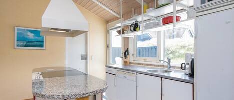 Fridge, stovetop, dishwasher, coffee/tea maker
