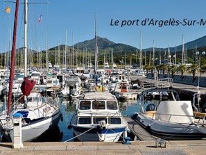 Enjoy scenic views of the marina and surrounding hills from this picturesque French destination.