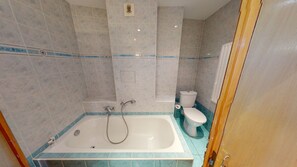 Bathtub, hair dryer, towels