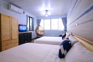 A hotel room with two beds, a television, a hanging chair, and a large window. - Traveler Station (Kaohsiung)