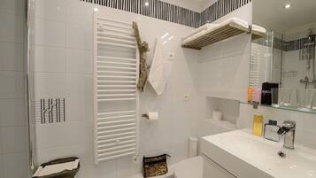 Shower, hair dryer, towels, soap