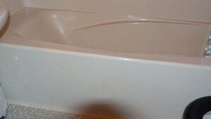 A bathtub with a white interior and a visible drain. - Cozy studio 3 pers. at ski slopes with Wifi (Les Arcs 1800)