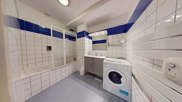 Bathtub, hair dryer, towels